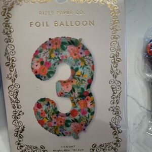 Number 3 balloon, hair bow, birthday sign and card